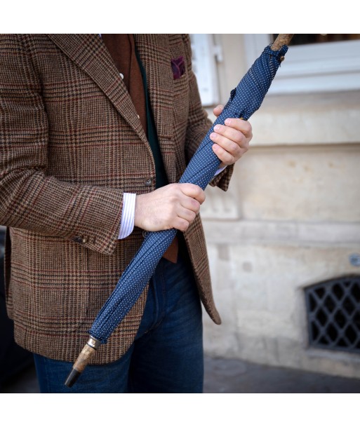 Parapluie bleu marine à pois blanc Les êtres humains sont 